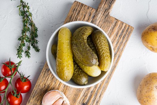 Marinated pickled cucumber set, on white background, top view flat lay
