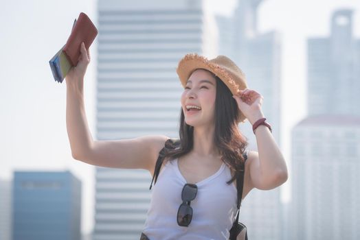 Beautiful asian solo tourist woman smiling and enjoying forr vacation travel in summer