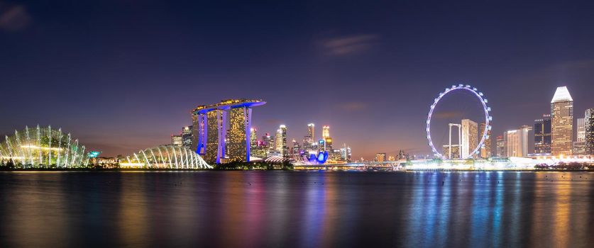 Panorama view of downtown business buildings area at night in Singapore.Singapore is a world famous tourist city.