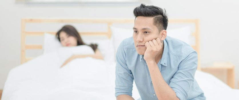 Young asian couple having argument and quarrelling with each other.Photo design for family problems and unhappy concept.