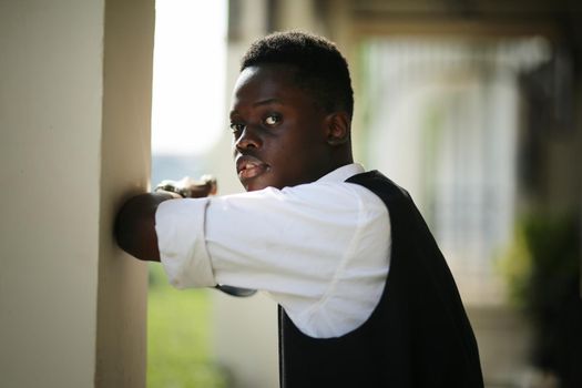 young handsome afro american man gesturing emotional posing on wall