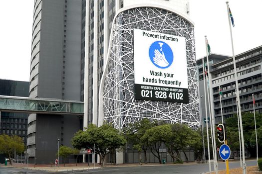 Cape Town, South Africa - 16 April 2020 : Hand washing sign on a buikding on an office building in Cape Town, South Africa