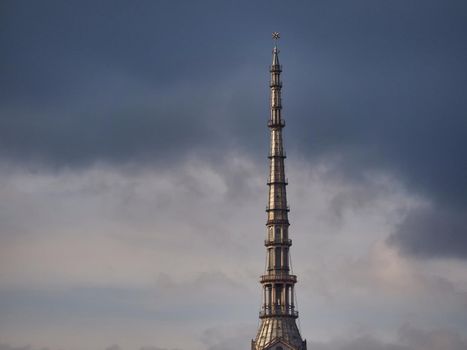 Scenic view of the spire of one of the city symbols, the mole antonelliana, from piazza castello under cloudy stormy sky Turin Italy October 10 2020