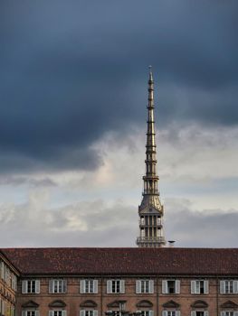 Scenic view of the spire of one of the city symbols, the mole antonelliana, from piazza castello under cloudy stormy sky Turin Italy October 10 2020