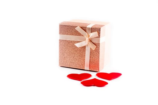 Valentine or other holiday present with red hearts and gifts box isolated on white background