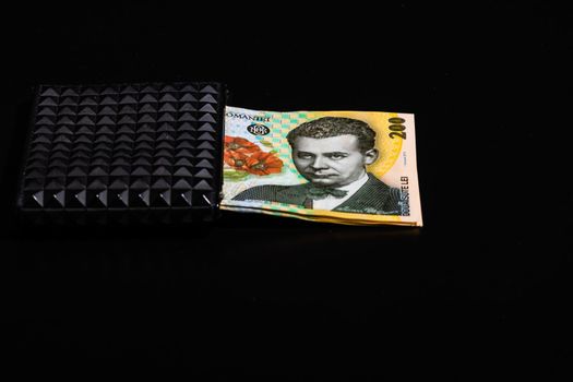 LEI romanian money banknotes in black wallet isolated