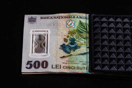 LEI romanian money banknotes in black wallet isolated