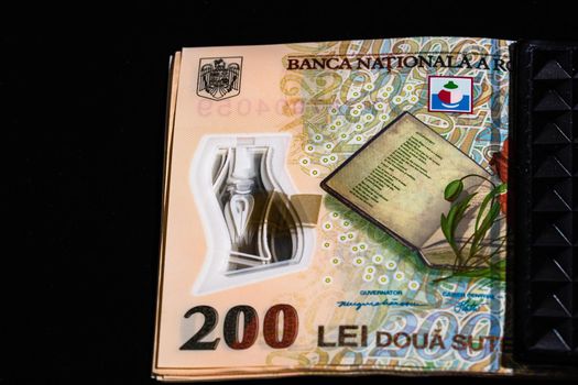 LEI romanian money banknotes in black wallet isolated