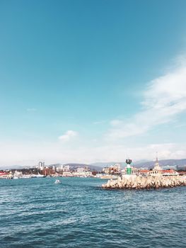SOCHI, RUSSIA - March 24, 2020. View on port, embankment and lighthouse from Black sea in sunny weather.