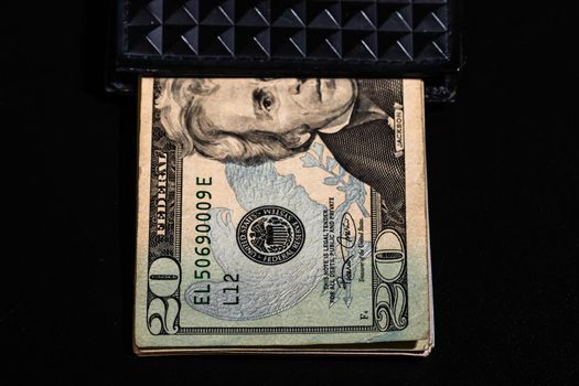 50 Dollars banknotes in a black wallet isolated.