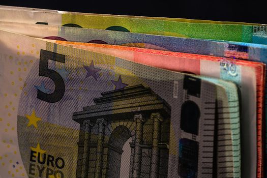 Close up on stack of EURO money. Euro banknotes isolated.
