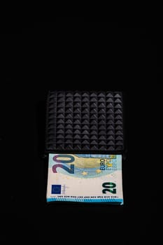 20 Euro money banknotes in black wallet isolated