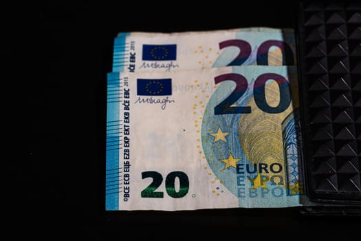 20 Euro money banknotes in black wallet isolated