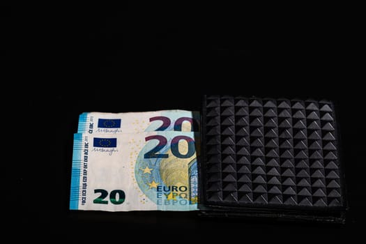 20 Euro money banknotes in black wallet isolated