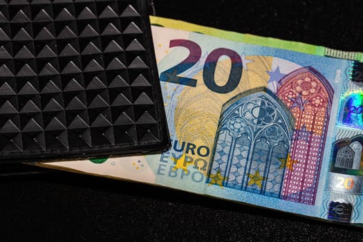 20 Euro money banknotes in black wallet isolated