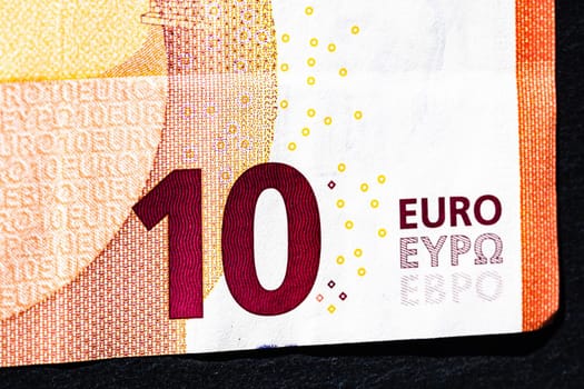 Selective focus on detail of euro banknotes. Close up macro detail of money banknotes, 10 euro isolated. World money concept, inflation and economy concept