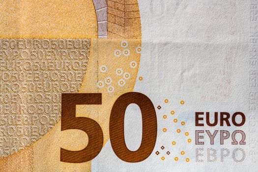 Selective focus on detail of euro banknotes. Close up macro detail of money banknotes, 50 euro isolated. World money concept, inflation and economy concept