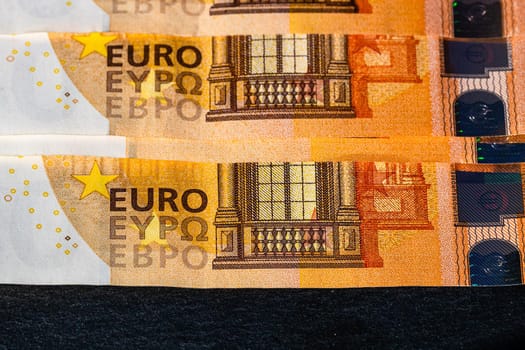 Selective focus on detail of euro banknotes. Close up macro detail of money banknotes, 50 euro isolated. World money concept, inflation and economy concept