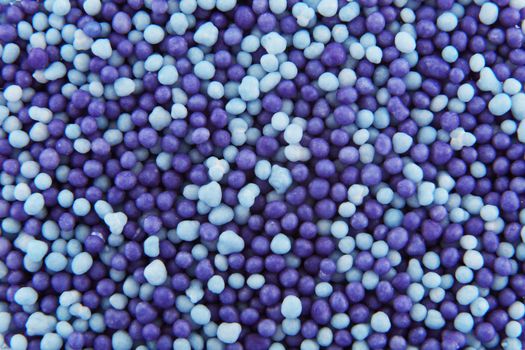 Light blue and purple hundreds and thousands sprinkles sugar beads used for decorating cakes and desserts