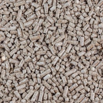 Compressed wooden sawdust pellets seamless texture and background. Alternative biofuel and pet litter, mulch.