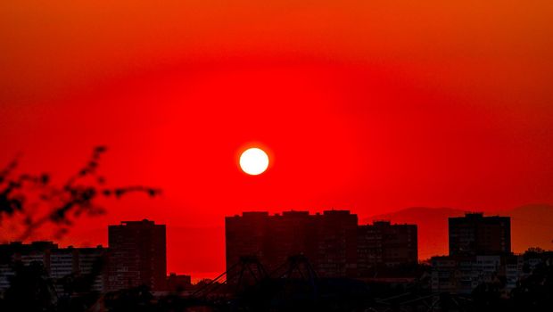 Red sunset over the city. Vladivostok, Russia