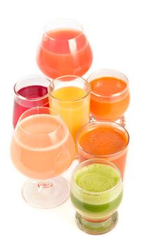 Glasses with fresh organic vegetable and fruit juices isolated on white. Detox diet