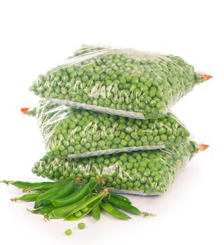 Composition with organic frozen vegetables on white background. Green peas in the package