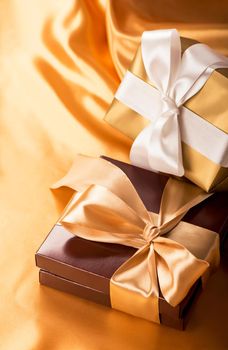 brown box with candies and golden tape close up