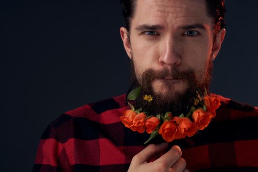 Cute bearded man flowers decoration plaid shirt emotions. High quality photo