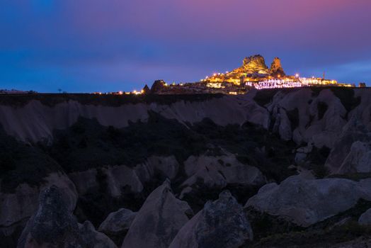 Goreme ancient city and a castle of Uchisar from a mountains after twilight, Cappadocia in Central Anatolia, Turkey