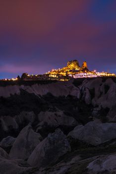 Goreme ancient city and a castle of Uchisar from a mountains after twilight, Cappadocia in Central Anatolia, Turkey