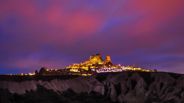 Goreme ancient city and a castle of Uchisar from a mountains after twilight, Cappadocia in Central Anatolia, Turkey