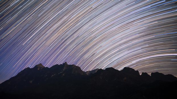 Star trails over Doi Luang Chiang Dao mountain at night, The famous mountain for tourist to visit in Chiang Mai,Thailand.