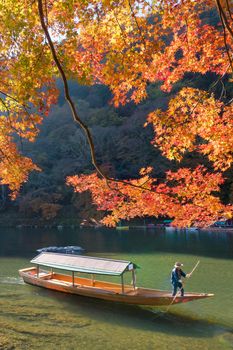 Beautiful nature view of Arashiyama in autumn season along the river in Kyoto, Japan. Arashiyama is a one of attraction landmark for tourist in Kyoto, Japan