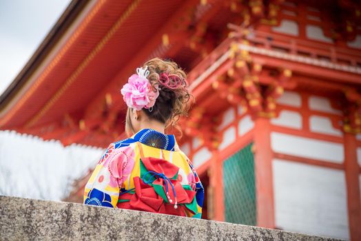 Asian women in traditional japanese kimonos at Kiyomizu dera Temple in Kyoto, Japan. Kiyomizu-Dera is one of the most celebrated temples of Japan and also UNESCO world heritage sites.