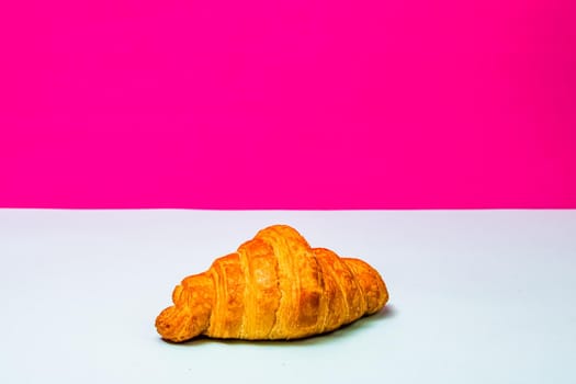 Detail of fresh croissant isolated, french breakfast concept.