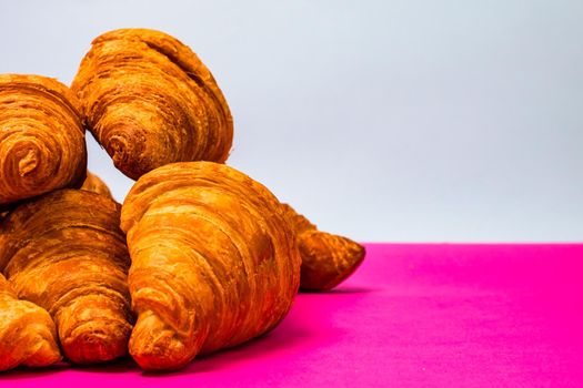 Fresh and delicious croissants isolated. French breakfast concept.