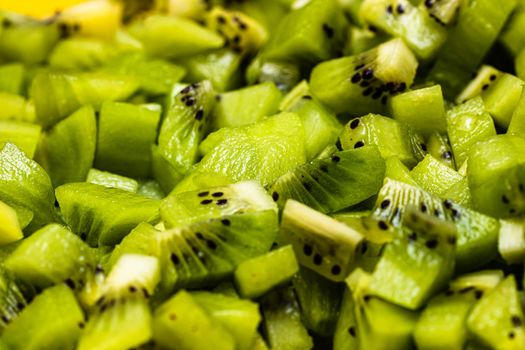 Ripe kiwi fruit. Detail of chopped exotic kiwi fruits used for desserts