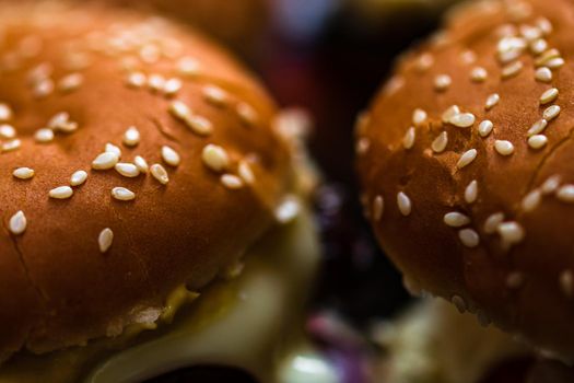 Closeup of fresh homemade tasty burgers on wooden table