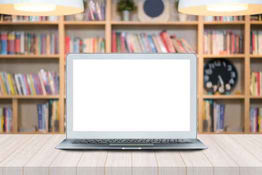 Smart modern laptop with white blank screen on wooden table in Co Working Space . Elegant Design with copy space for placement your template mock up.