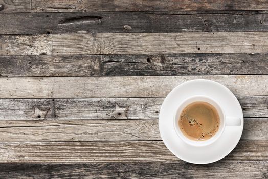 Flat lay Espresso coffee in coffee cup with copy-space on wooden table background.