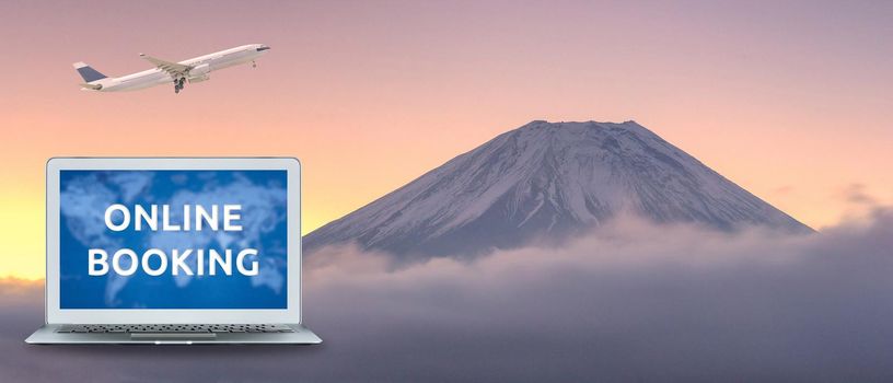 Commercial airplane flying over beautiful natural landscape view of Mount Fuji during sunrise in winter season at Japan. Elegant Design with copy space for travel concept.