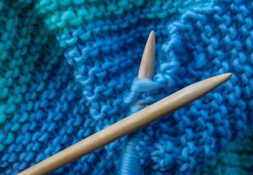 Wooden Knitting Needles Being Used To Knit A Woollen Blanket, With Copy Space