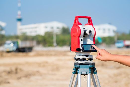 Civil engineer use surveyor equipment theodolite checking construction site for new Infrastructure project. photo concept for engineering work.