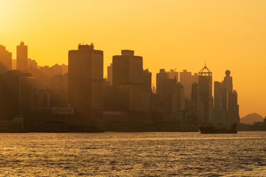 Hong Kong Logistic harbour port with high rise building at sunset