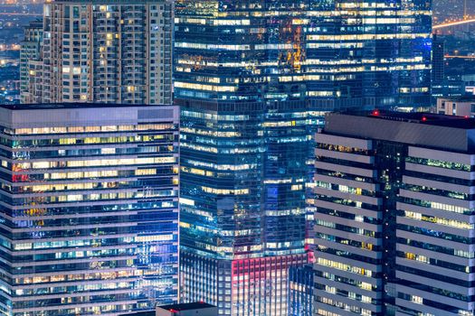 Modern building skyline at business zone in big downtown at night