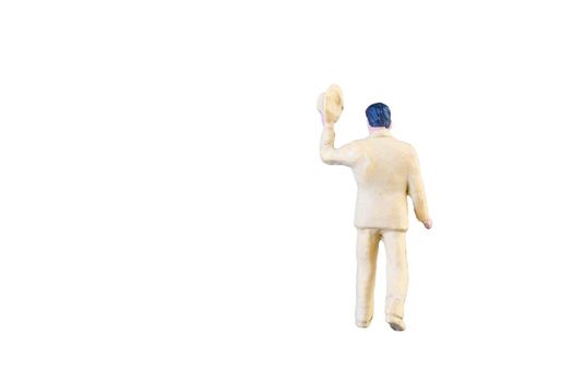 Close up of Miniature people isolated with clipping path on white background.