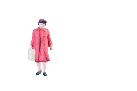 Close up of Miniature people isolated with clipping path on white background.