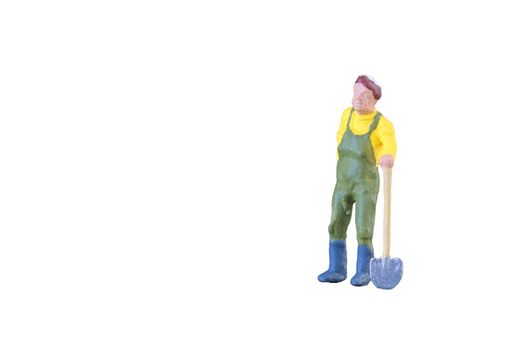Close up of Miniature farmer people isolated with clipping path on white background . Elegant Design with copy space for placement your text, mock up for farmer and gradening concept