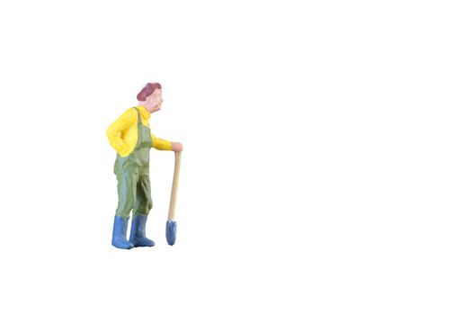 Close up of Miniature farmer people isolated with clipping path on white background . Elegant Design with copy space for placement your text, mock up for farmer and gradening concept.